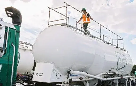 Man walking on top of trailer - handrail fall protection