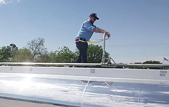 Man walking on top of trailer - SFTram fall protection system